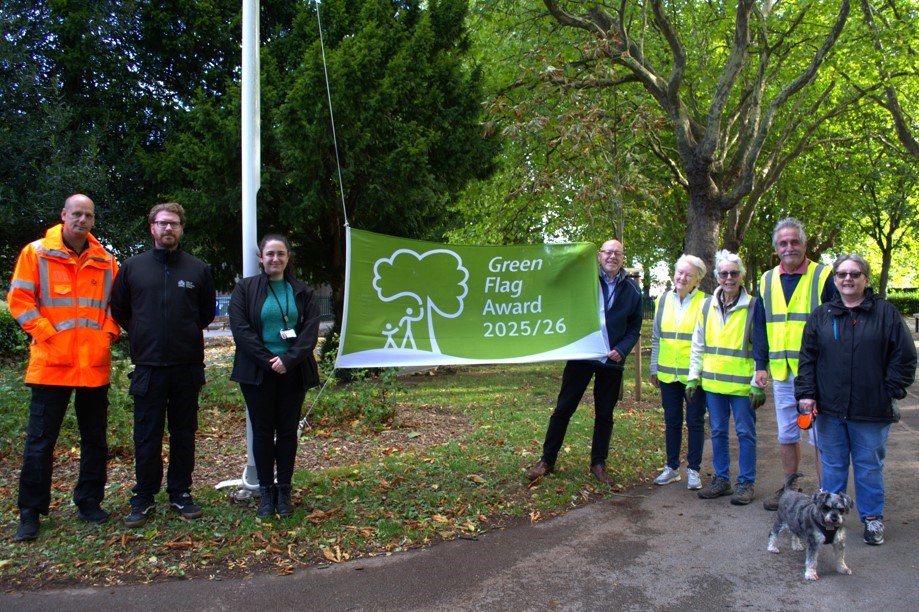 People standing by the Green Flag for Hexthorpe Park